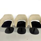 Series of six swivel chairs with an organic shell, patterned fabric and base.