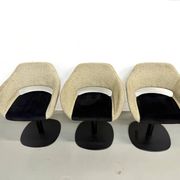 Series of six swivel chairs with organic shell, mottled fabric and base dis