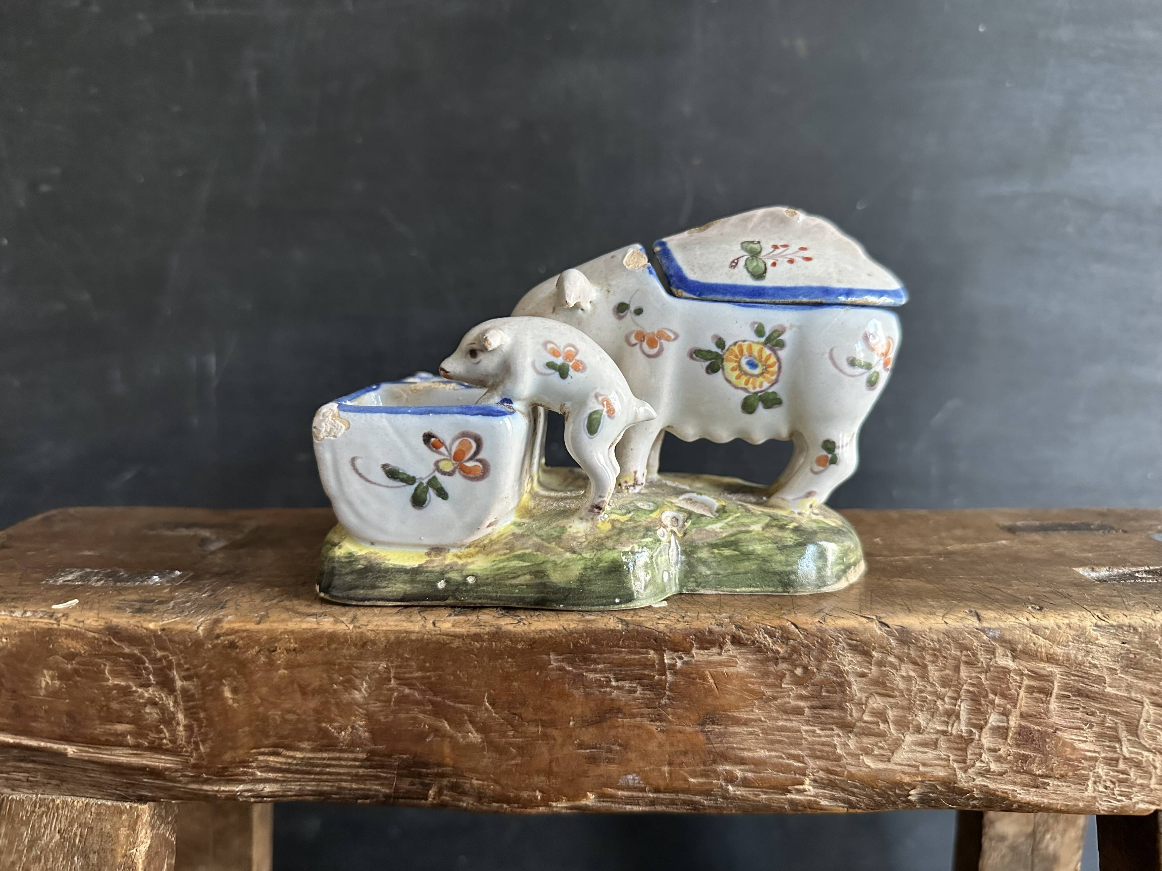 Antique earthenware pig box, salt cellar or mustard pot, floral decoration.