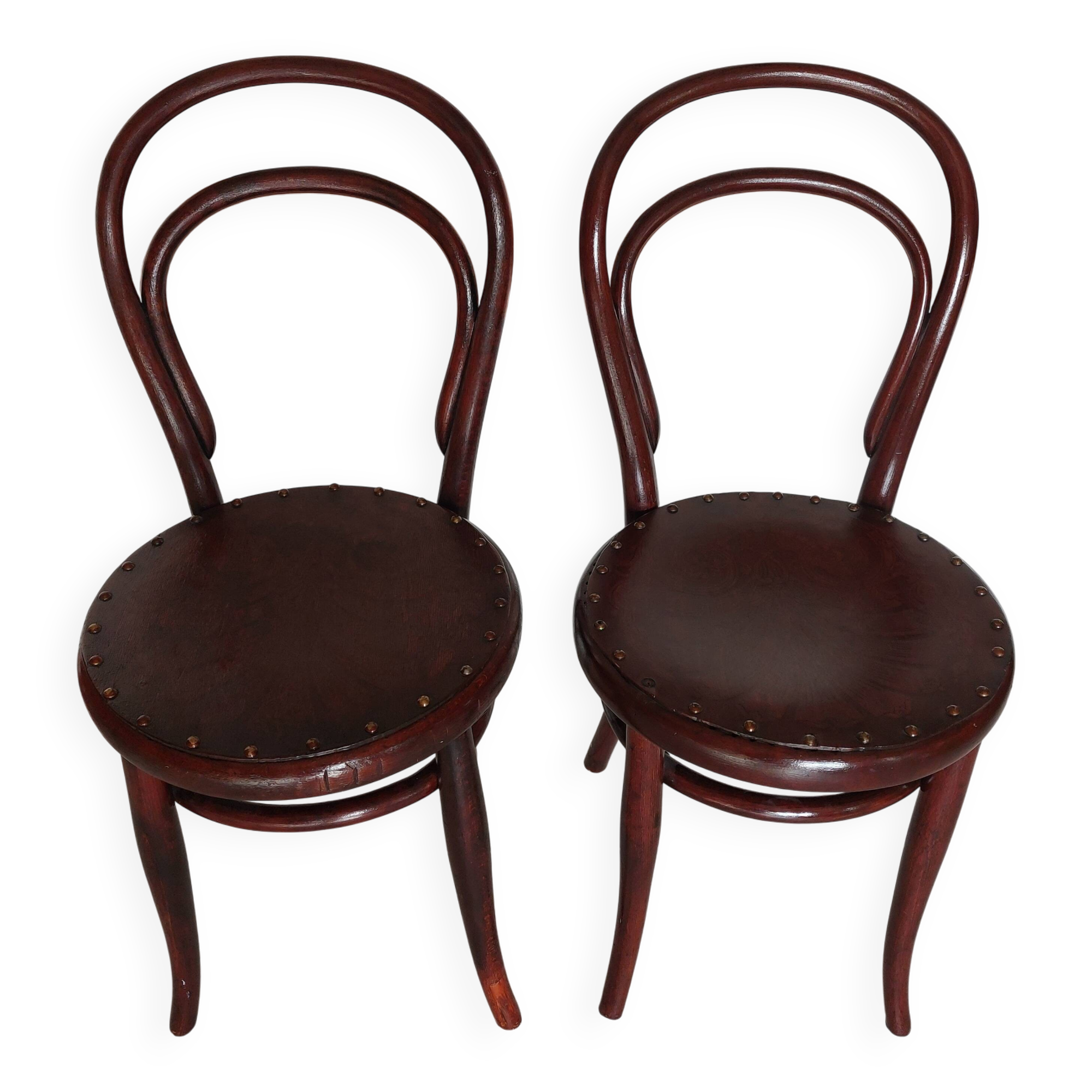 pair of round bistro chairs with a pattern on the seat, vintage