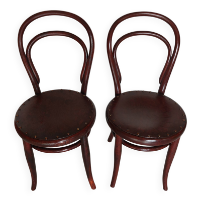 paire de chaises bistrot rondes avec motif sur l'assise, vintage