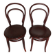 pair of round bistro chairs with a pattern on the seat, vintage