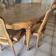 Oval cherry wood table made by a cabinetmaker, with 3 extensions and 8 chairs.