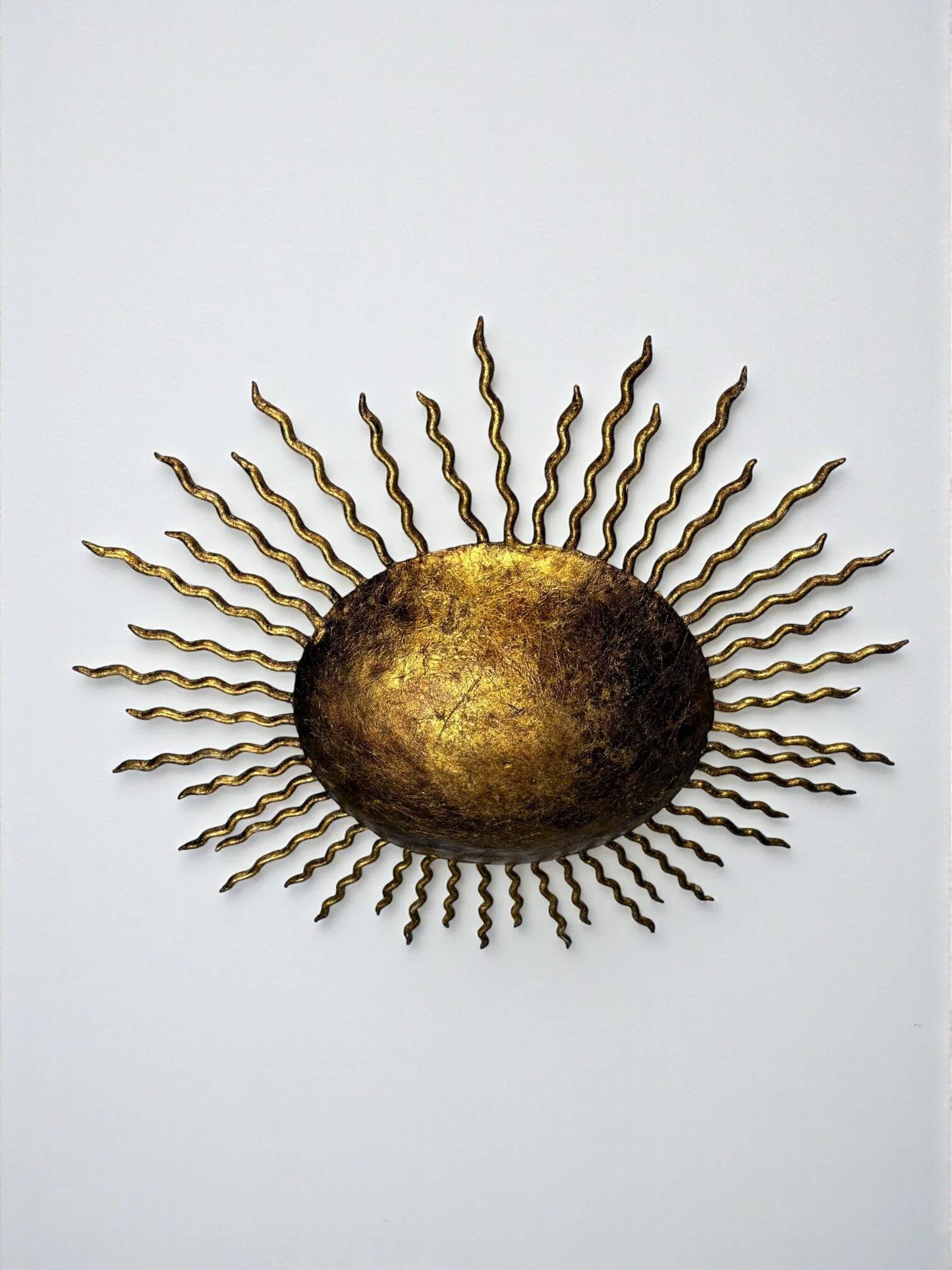 French gilt metal sunburst light fixture, Gilbert Poillerat, 1930s France