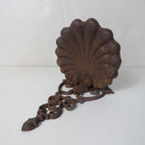 Old cast iron planter shell-shaped plant support