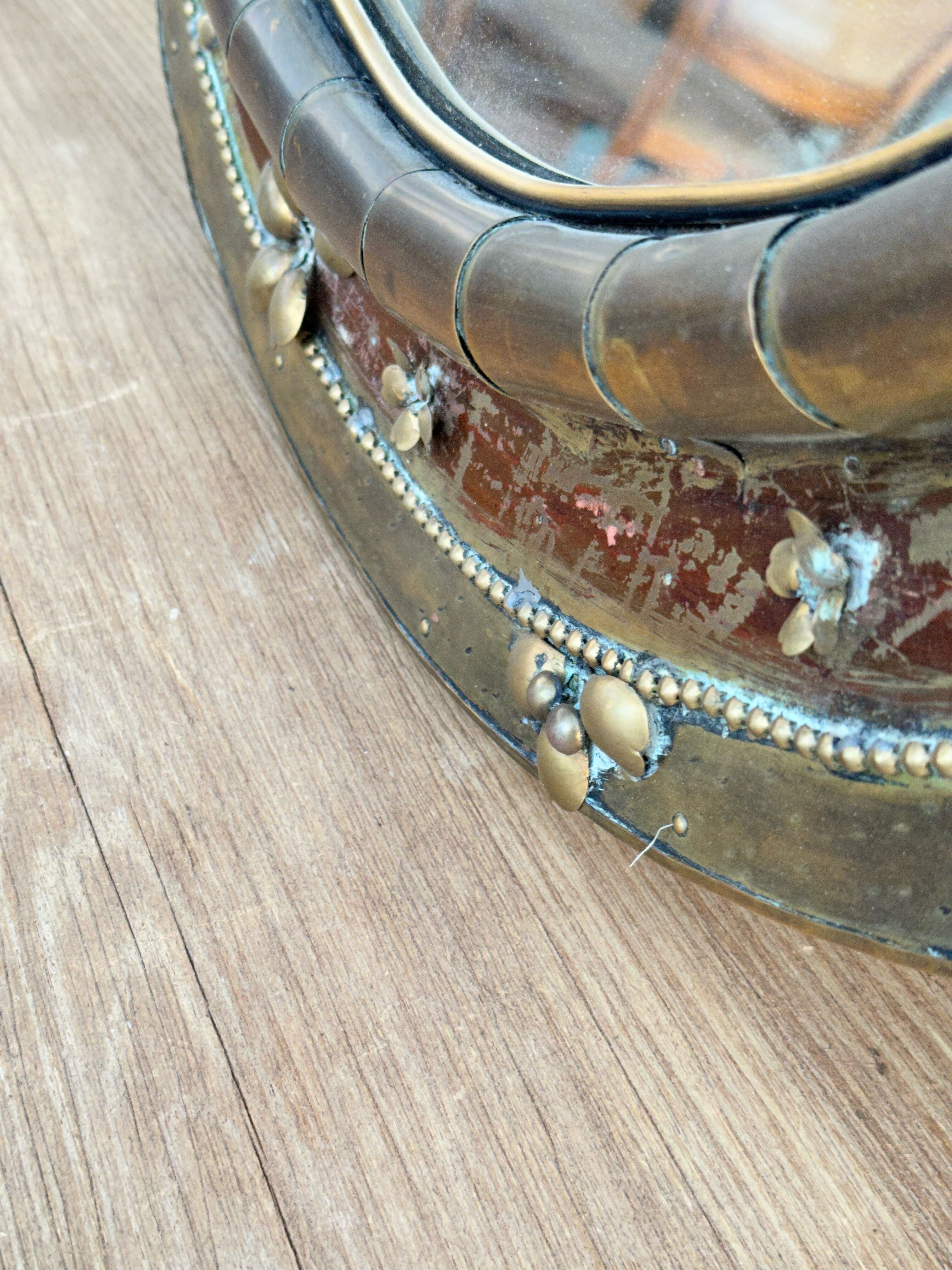 Round mirror in worked copper, Italy 1950