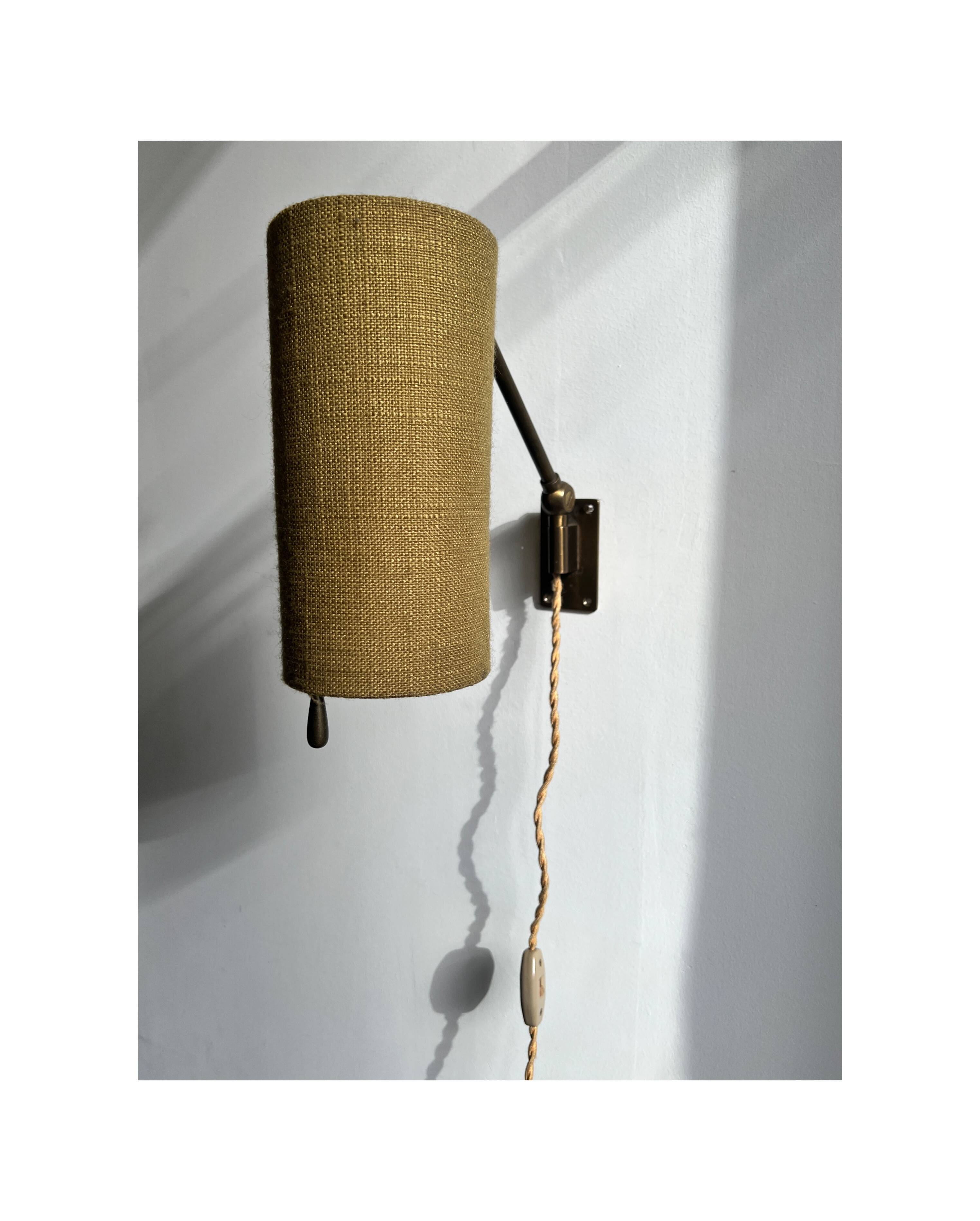 Wall sconce, brass bracket and khaki lampshade, France 1950