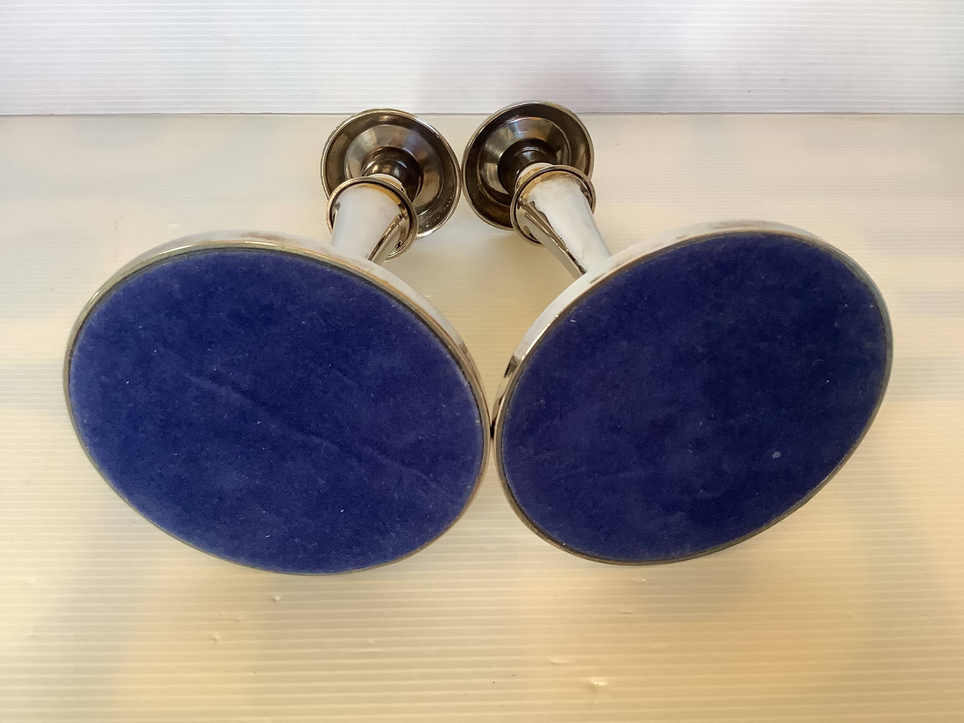 Pair of silver-plated zinc metal candlesticks