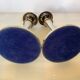 Pair of silver-plated zinc metal candlesticks