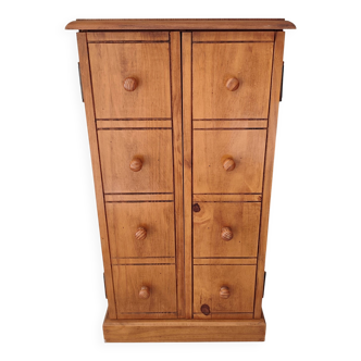 Small wooden piece of furniture, cabinet style, false drawers.