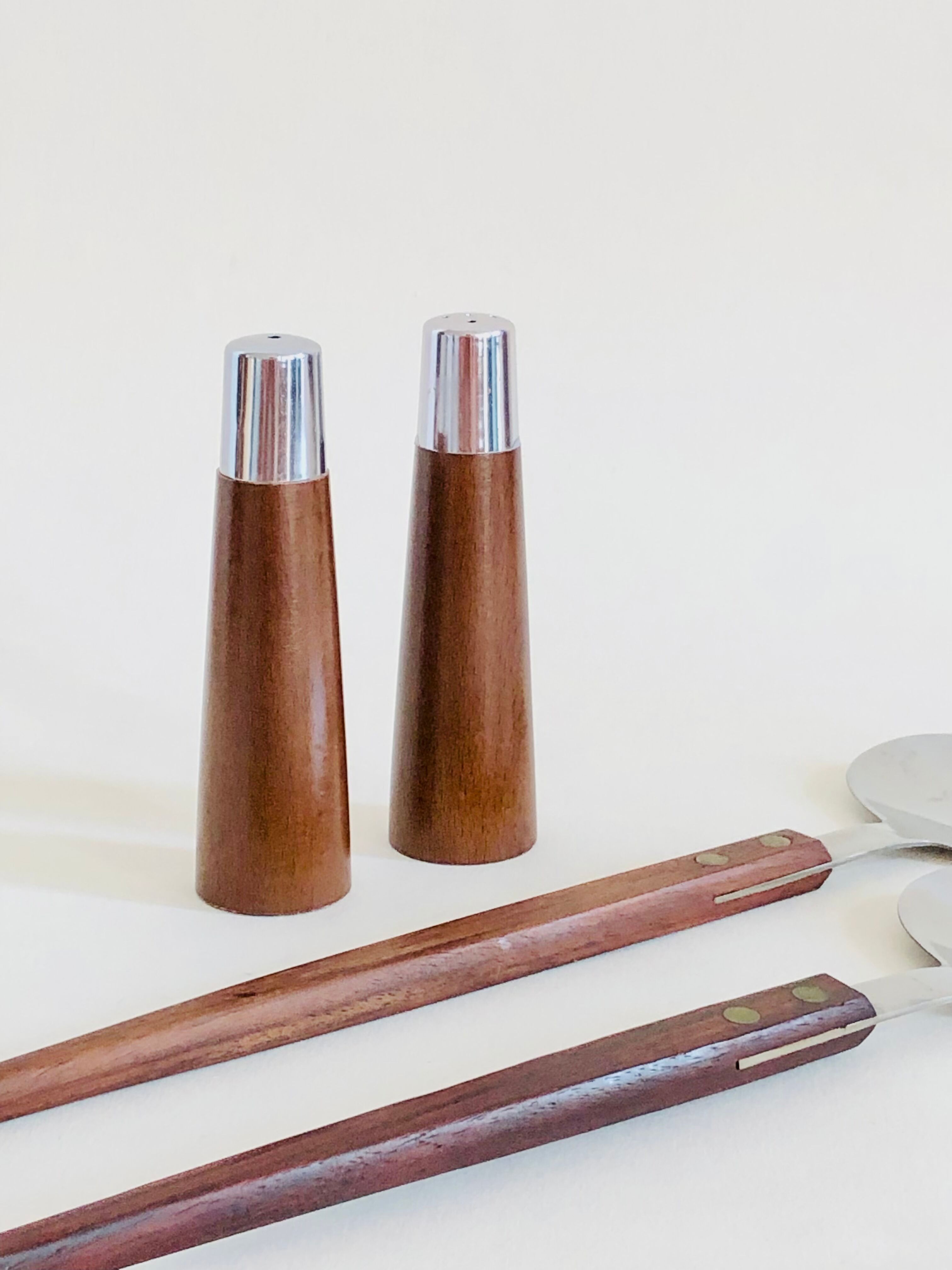 Set of Scandinavian salad cutlery, salt and pepper shaker in teak and steel