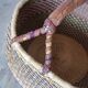 African braided basket, leather handle