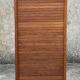 Vintage wooden filing cabinet with curtains.