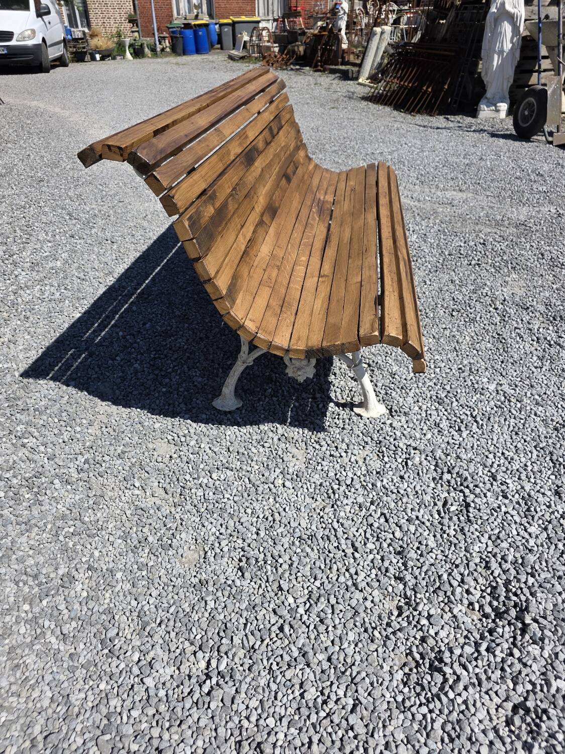 Antique garden bench made of cast iron and oak slats