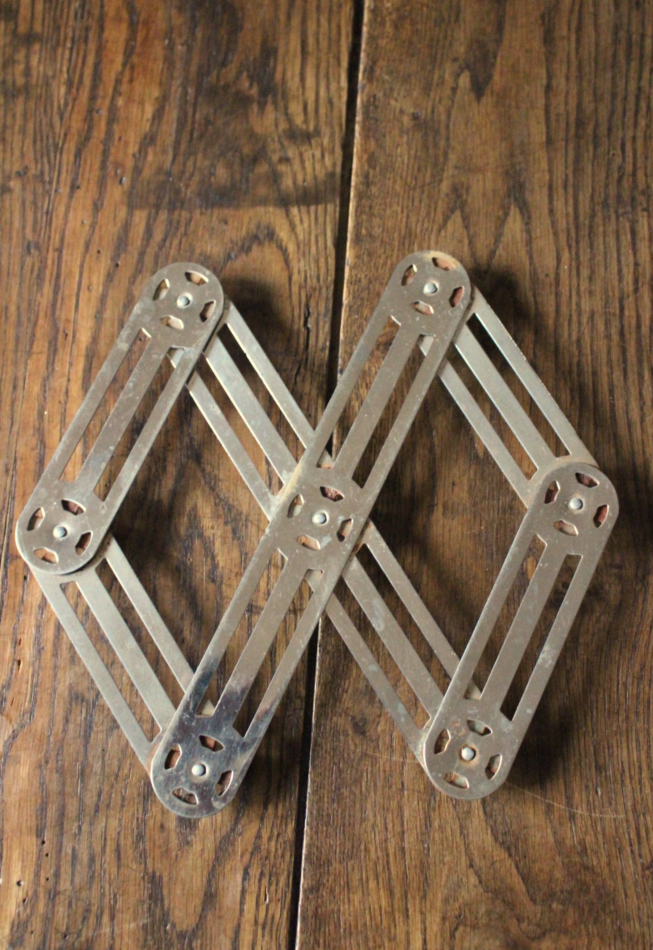 Vintage folding metal trivet