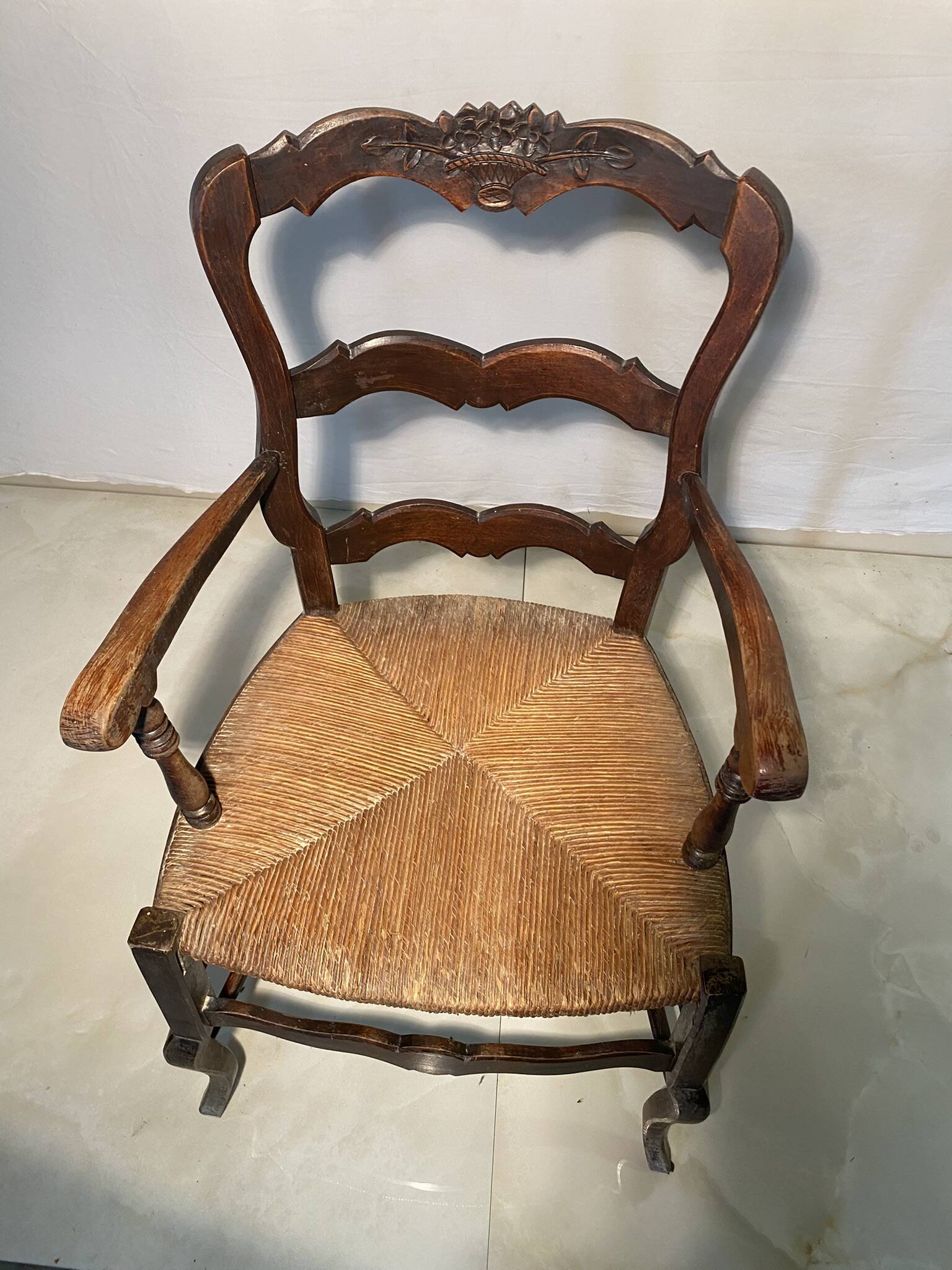 Antique Provencal armchair in carved wood with straw seat