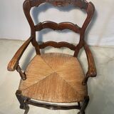 Fauteuil provençal ancien en bois sculpté avec assise en paille