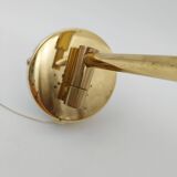 Pair of articulated arm wall lights in brass with opaline globe