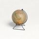 Old illuminated globe world map made of glass and paper.