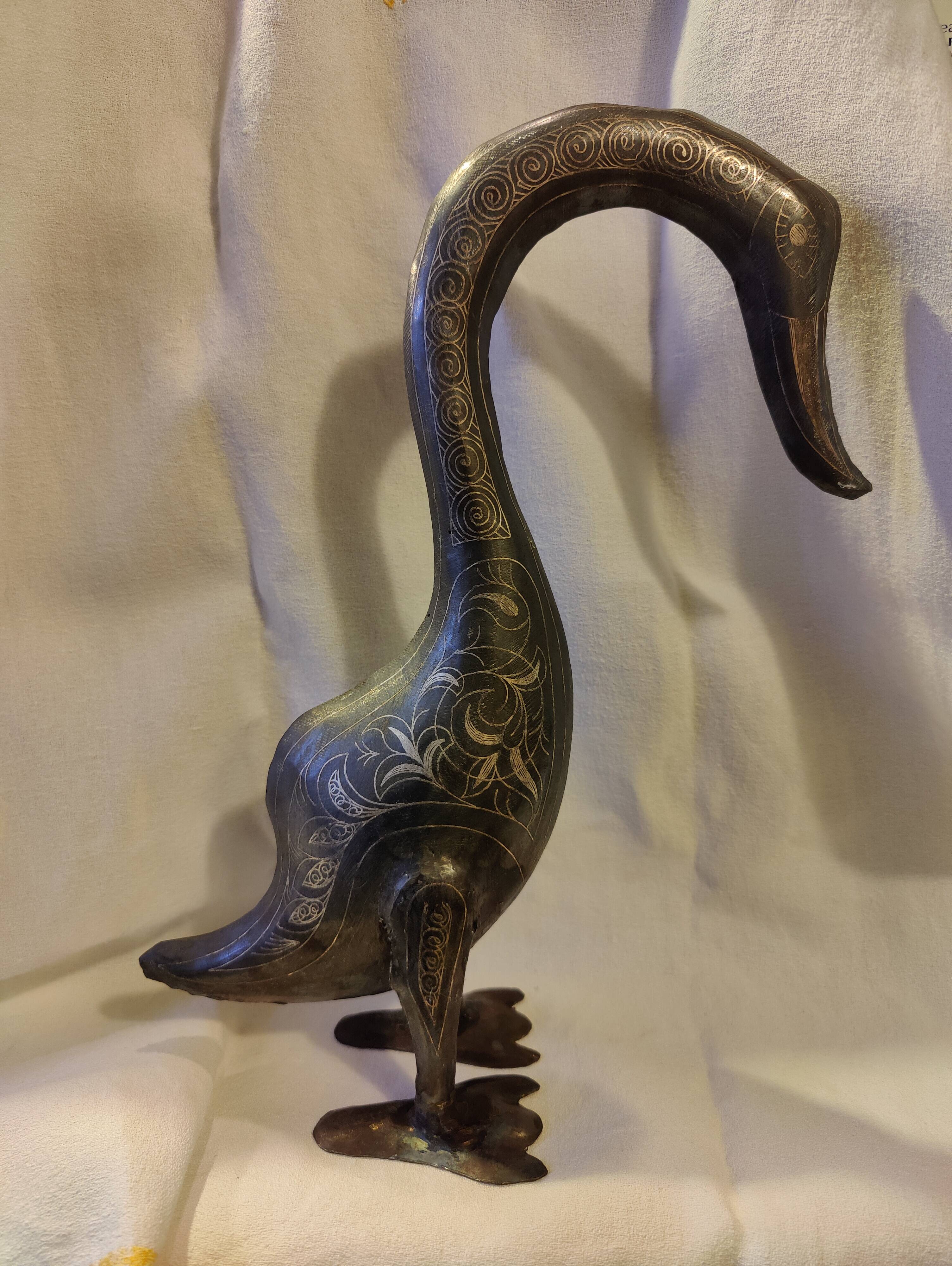 Damascened metal bird sculpture