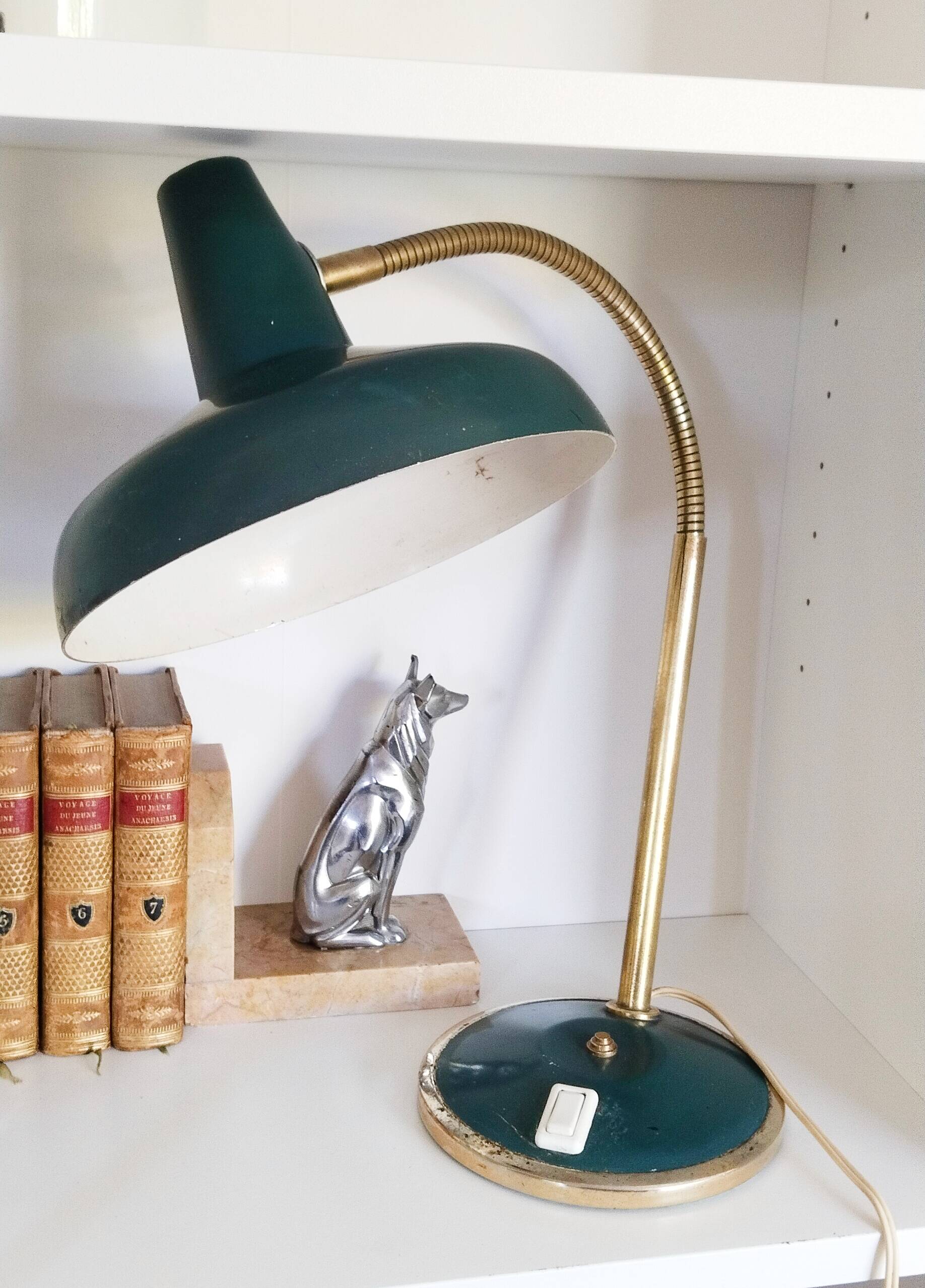 Green and gold articulated desk lamp