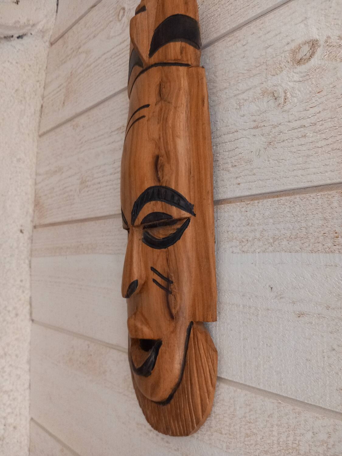 African mask in light wood