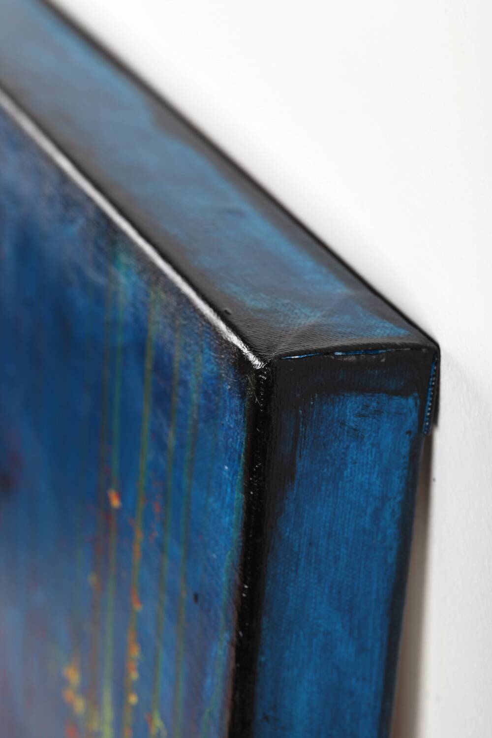 Contemporary abstract artwork in blue, red,black, yelow on stretched canvas