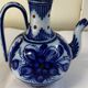 Glazed ceramic carafe with floral decoration