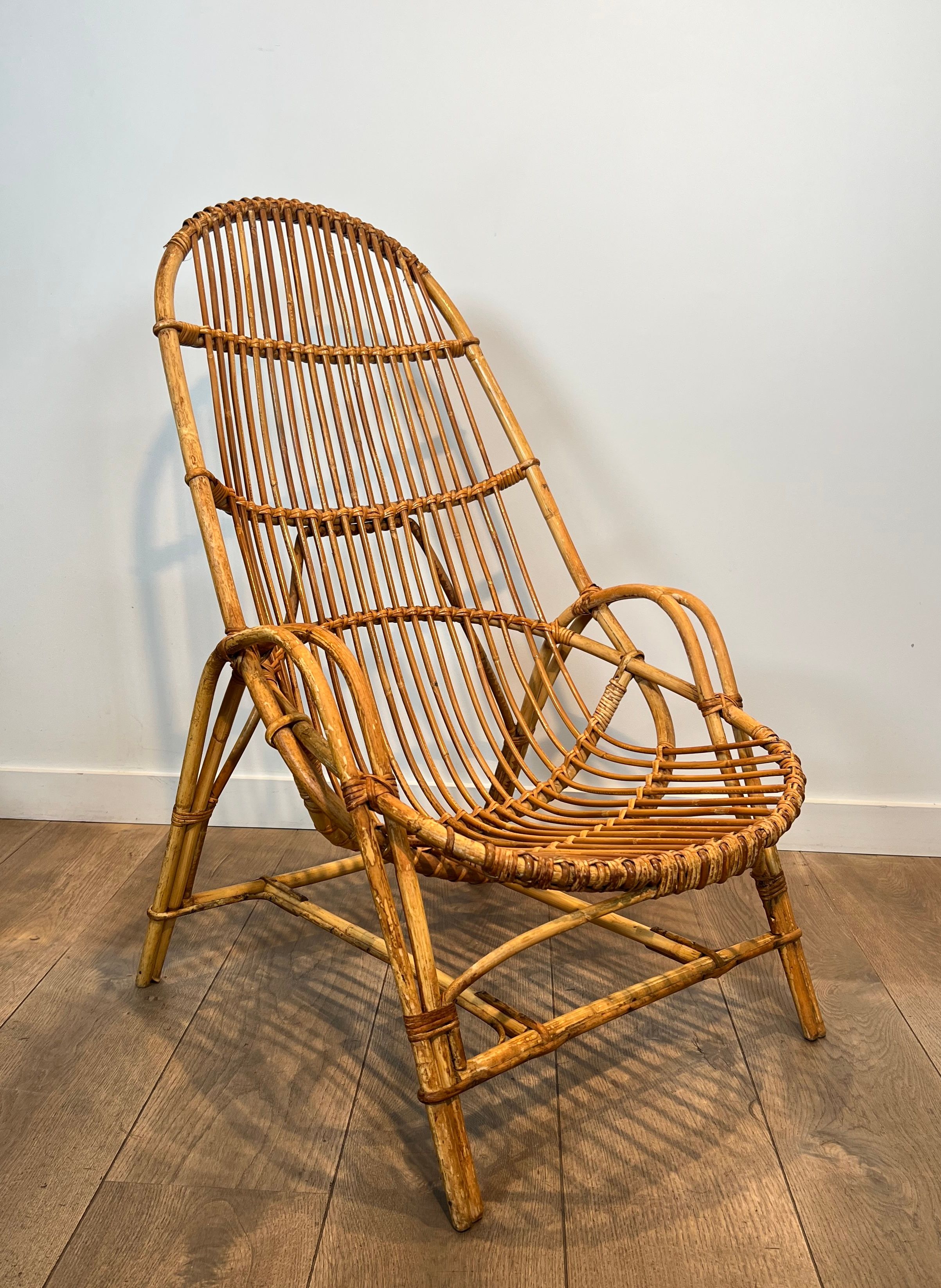 Pair of designer armchairs in rattan