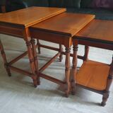 Nesting tables in solid cherry wood held together by slides