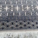 Vintage hand knotted rug with geometric patterns on a grey/beige/terracotta background 170 x 96 cm