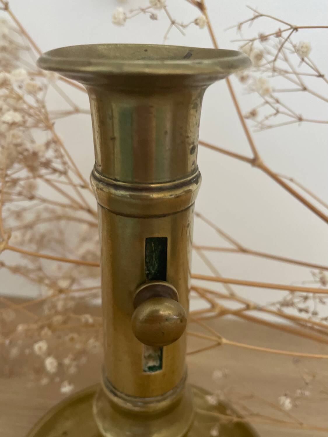 Brass candle holder with push button