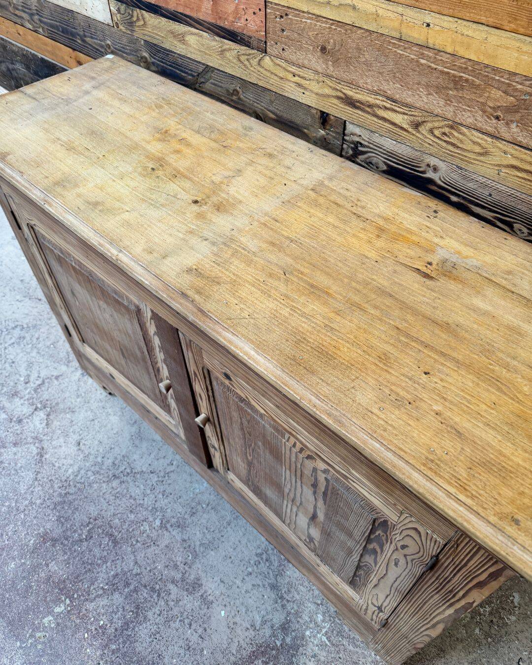 Old low sideboard in solid pitch pine