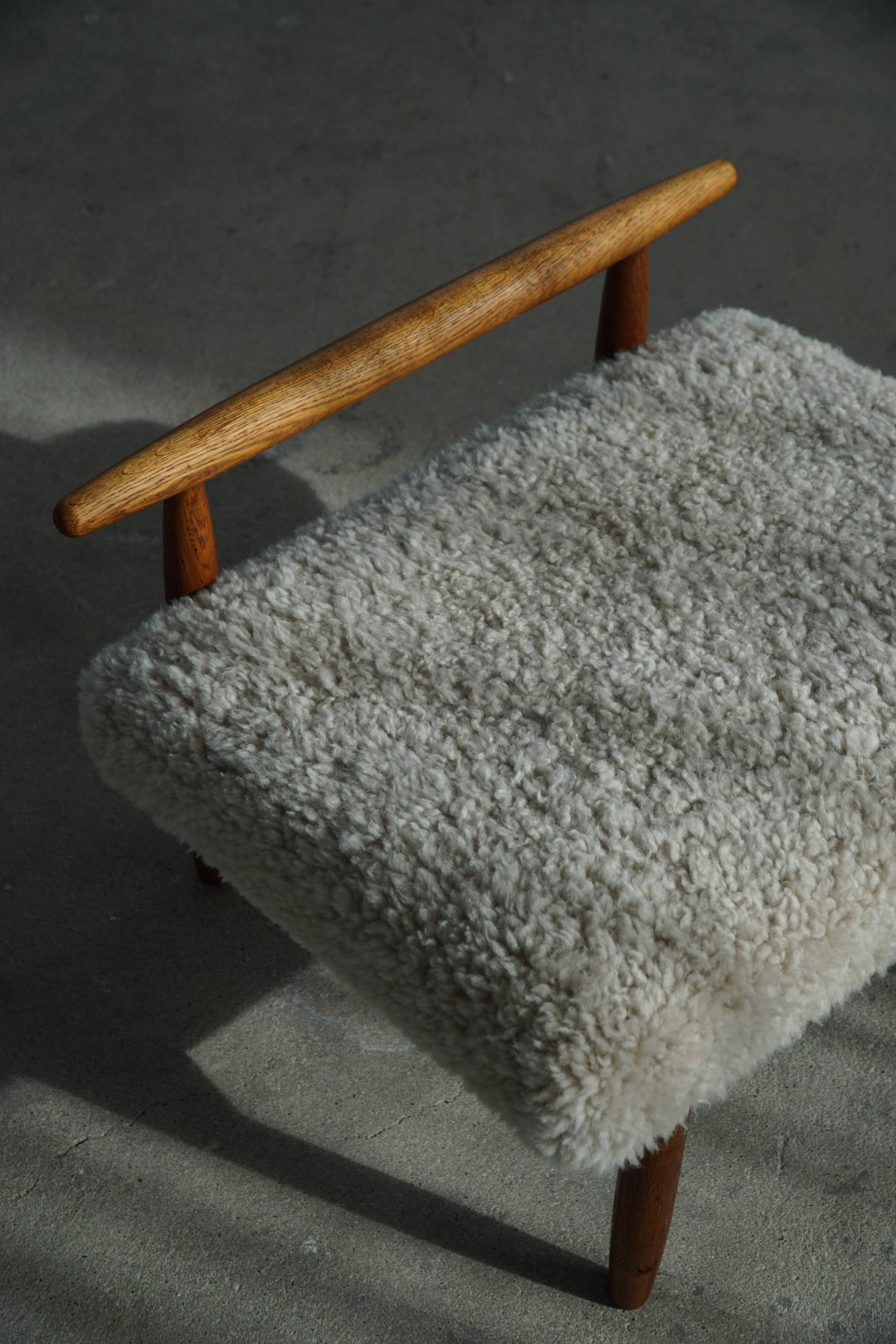 Eivind A. Johansen, oak footrest with light lambswool padding for FDB Møbler
