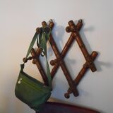 1900 accordion coat holder