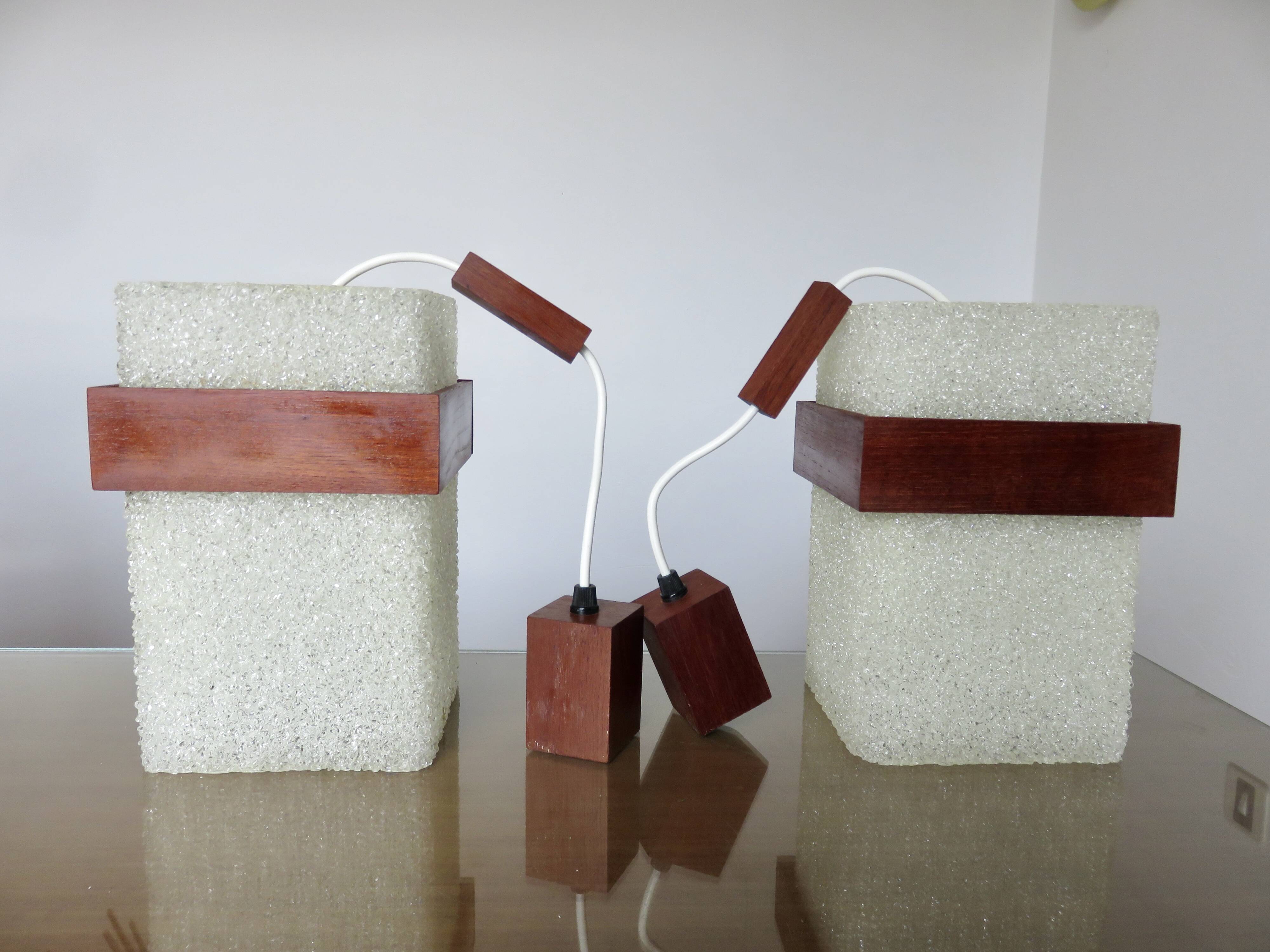 Pair of Scandinavian pendant lights in teak and perspex, 1970s.