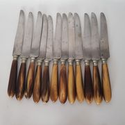 Twelve knives, horn handle, steel blade signed Philip CADET Marseille