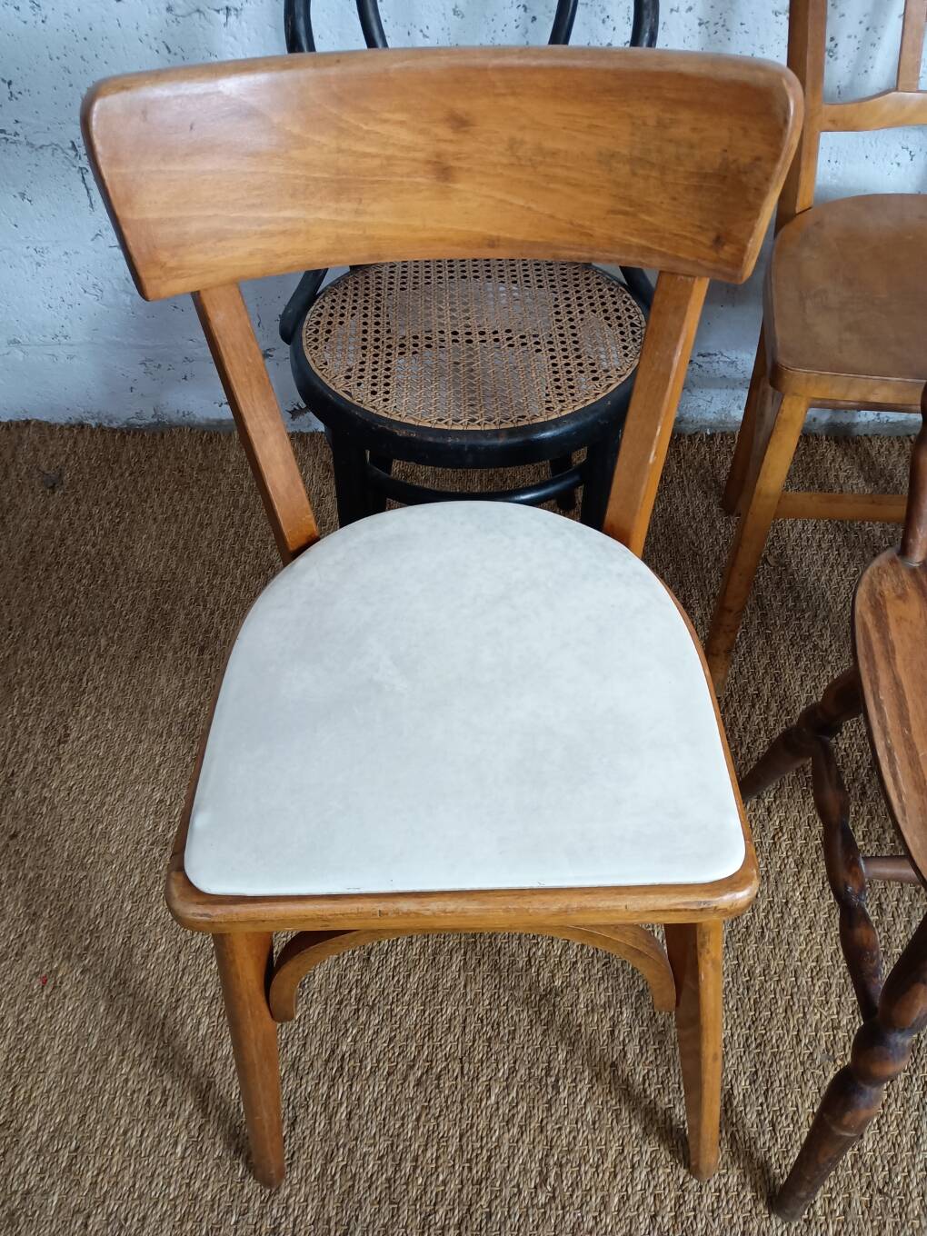 Set of 8 mismatched vintage Baumann Lebrun bistro chairs.