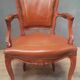 Louis XV style armchair covered in leather.