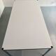 Large table design USM Haller with a white top and chrome structure.