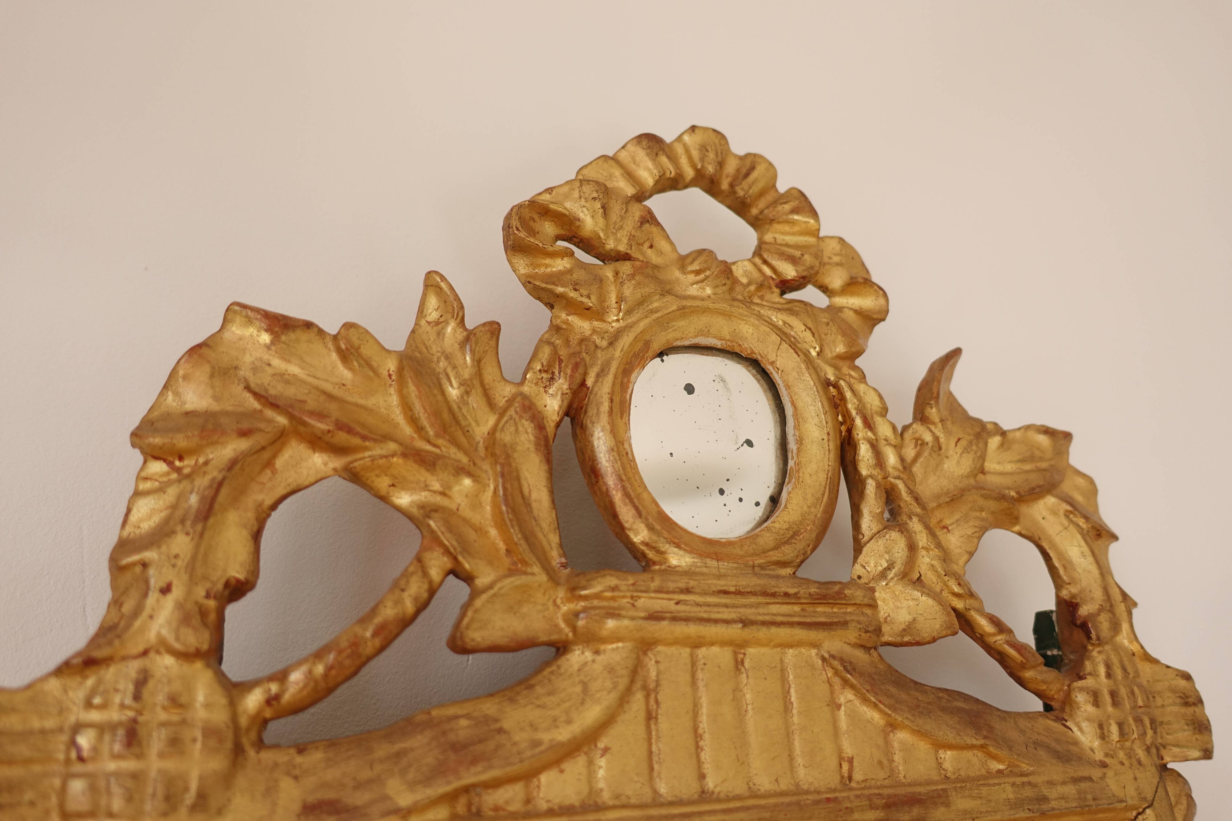 Miroir Louis XVI en bois doré 35x 65cm