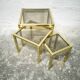 Trio of nesting tables in brass and smoked glass