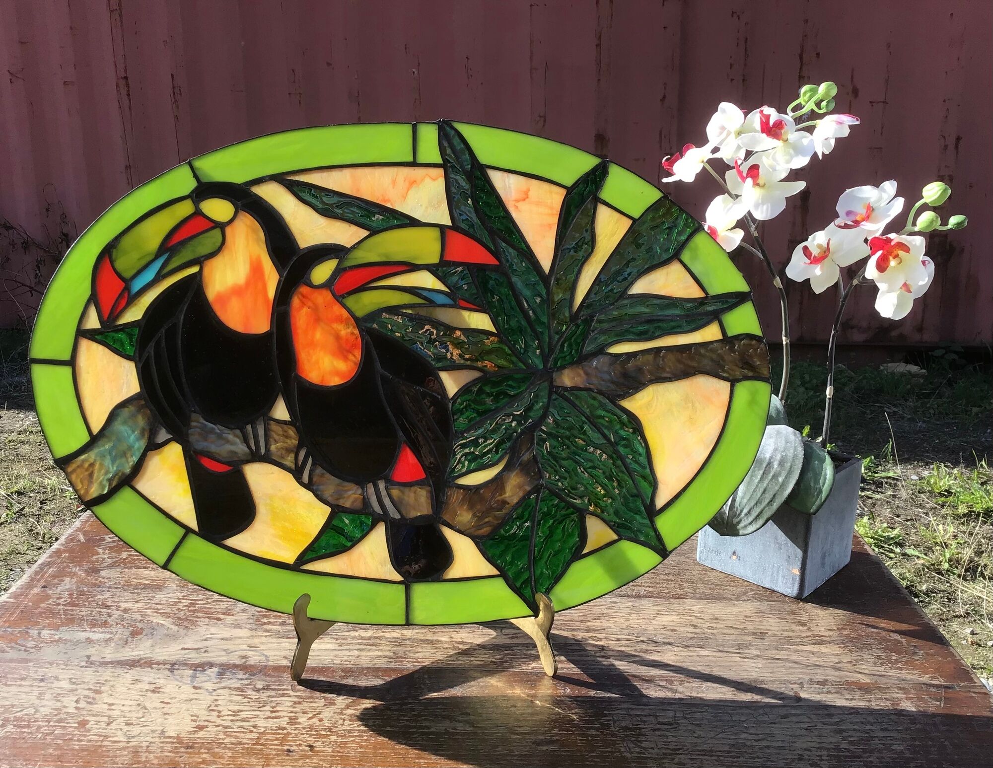 Art Deco style stained glass window representing a couple of toucans