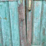 Pair of old wooden shutters green mint color