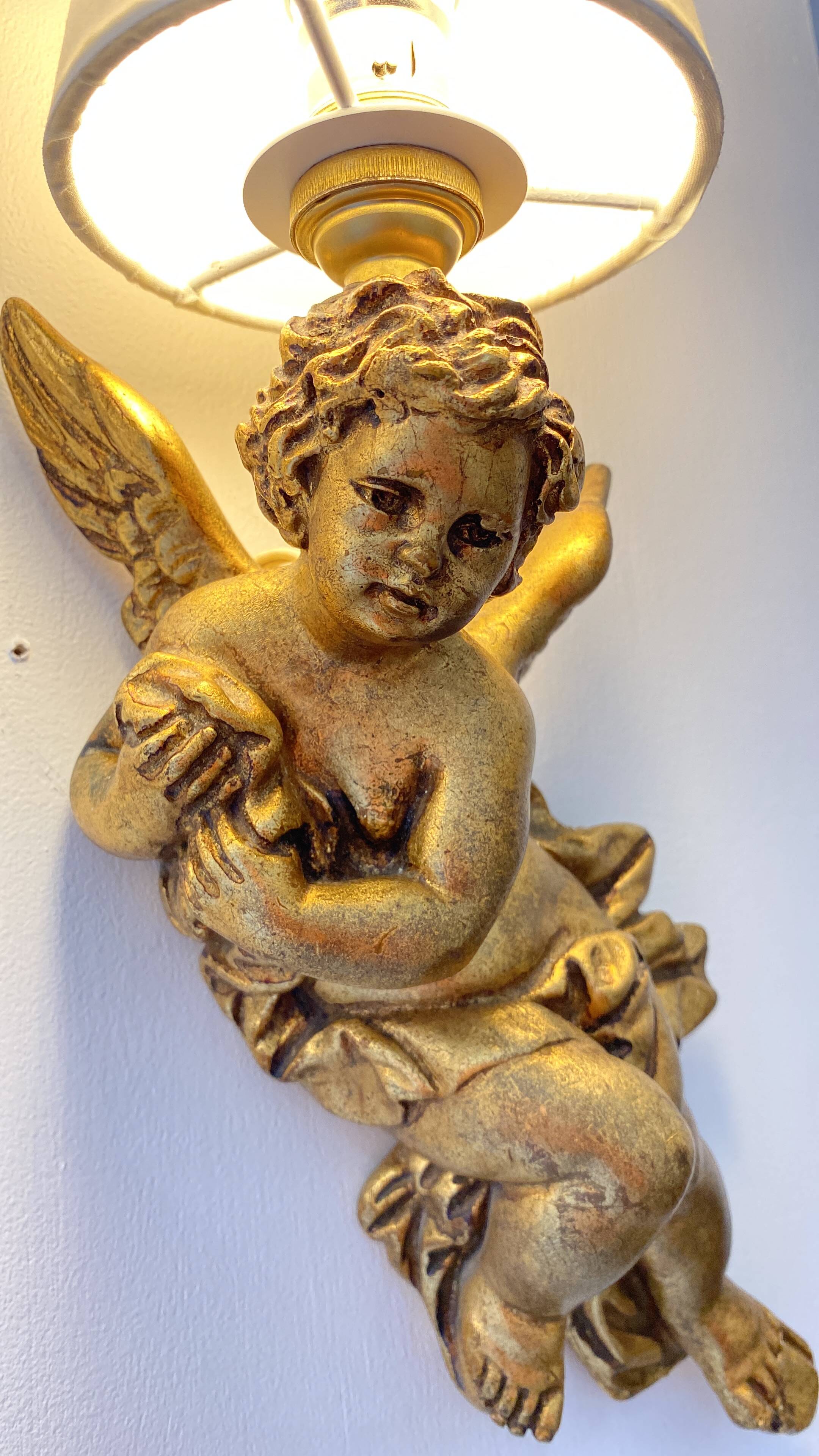 Pair of golden Puttis wall lights