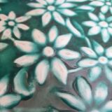 Dessous de plat vert à fleurs