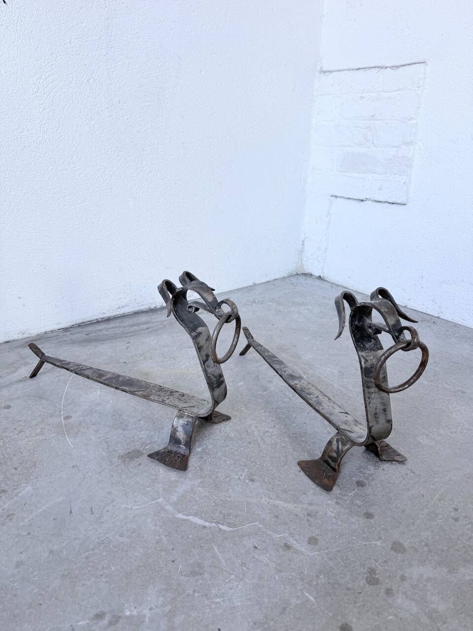 Pair of zoomorphic metal andirons "dogs" 1950