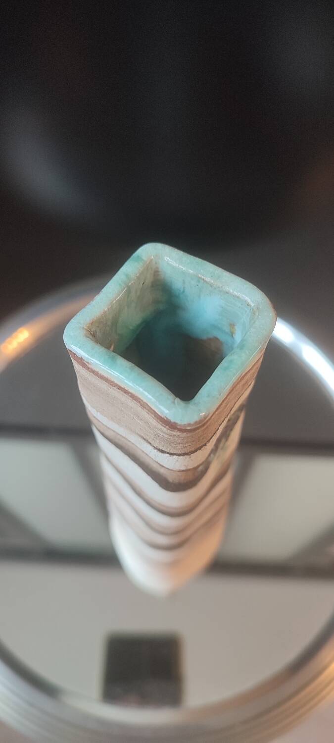 Turned stoneware vase signed with relief decoration.