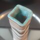 Turned stoneware vase signed with relief decoration.