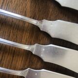 10 mismatched fish knives, silver metal